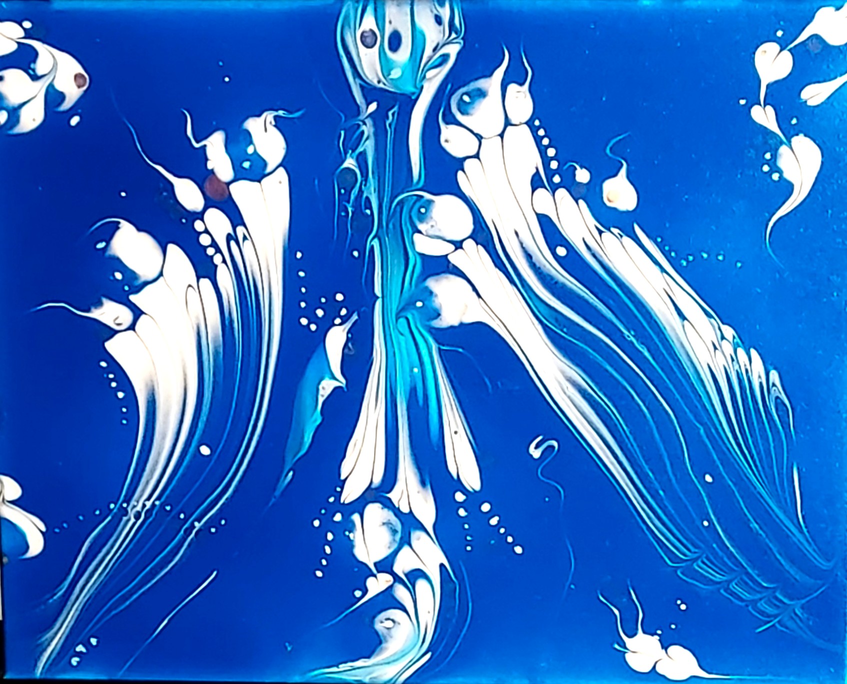 Abstract blue and white fluid patterns resembling flowing underwater aliens.