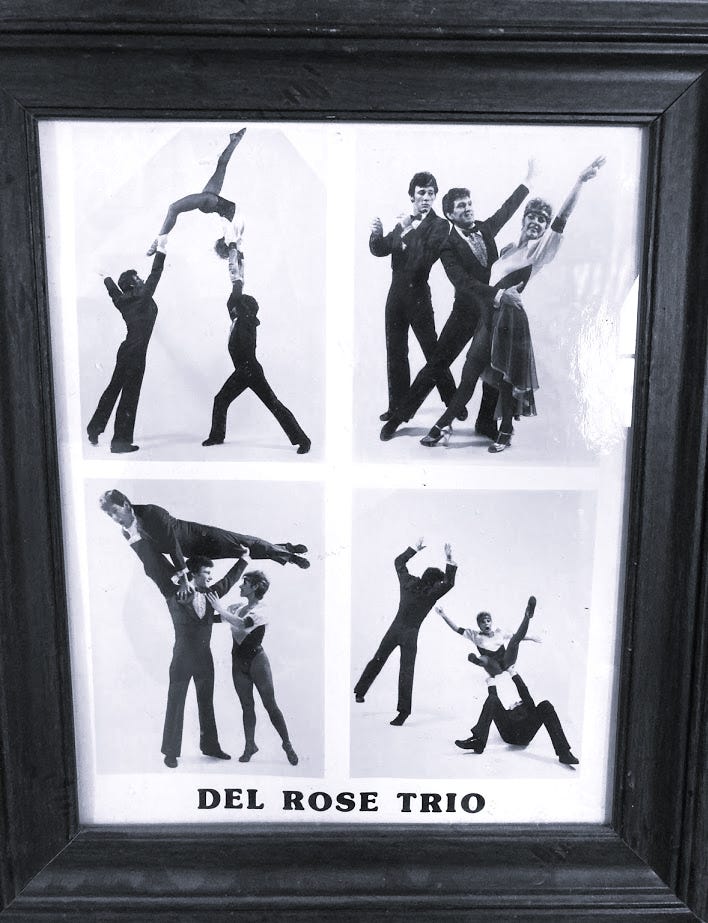 A framed black and white collage featuring the Del Rose Trio performing acrobatic dance poses. The top left image shows one performer lifting another, while the top right features two performers in tuxedos posing with a female dancer. The bottom left shows a performer lifting a female dancer and the bottom right depicts dynamic dance movements.