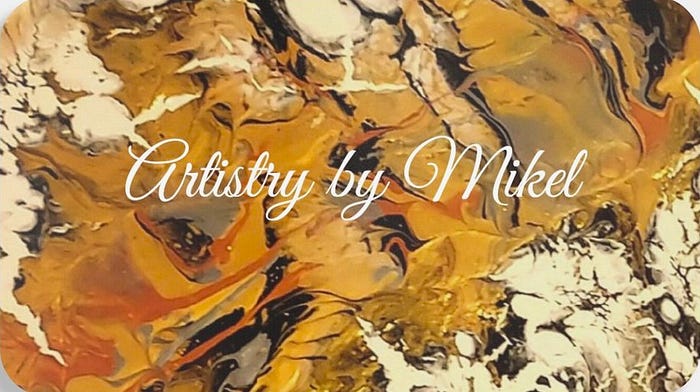An abstract artwork featuring a blend of warm colors including orange, gold, and white, with the text 'Artistry by Mikel' elegantly scripted across the design.